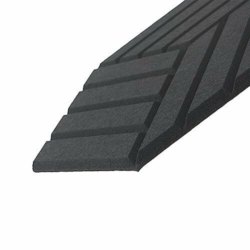 Black acoustic foam panel with diagonal grooves