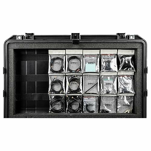 Open storage case with organized audio equipment.