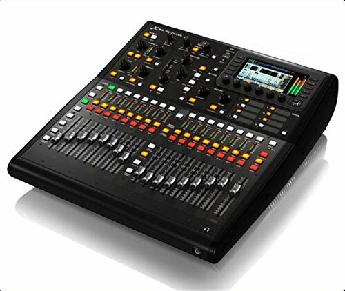 Digital audio mixing console with various controls and display screen