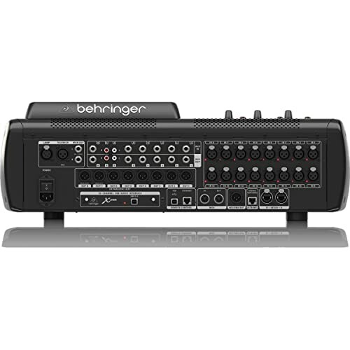 Back view of a Behringer audio mixer with various input and output ports.