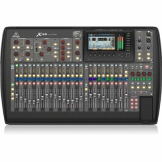 Behringer X32 digital mixer with multiple controls and display