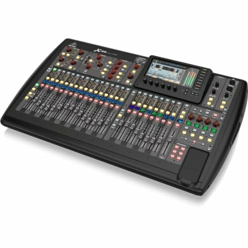 Behringer X32 digital mixing console with display and controls.