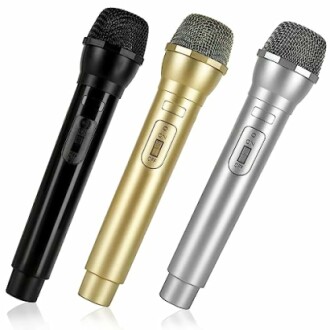 Three wireless microphones in black, gold, and silver colors.