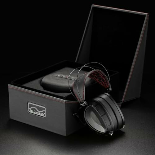 High-end headphones with a box and carrying case on display.