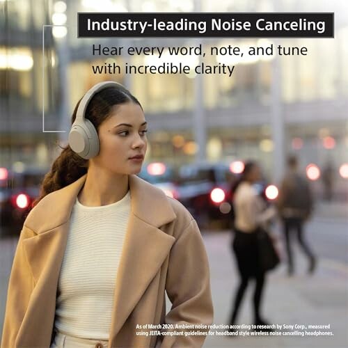 Woman wearing noise-canceling headphones with city backdrop.