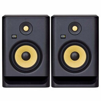 Pair of black and yellow KRK studio monitors.