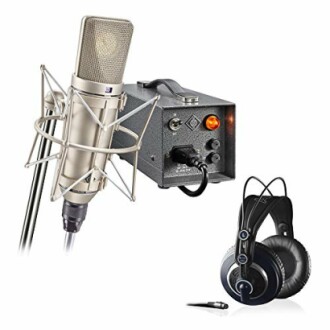 Professional microphone with headphones and audio equipment.