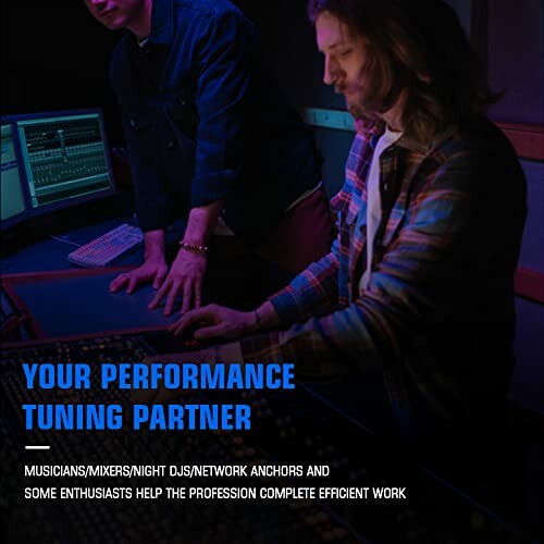 Two people working at a sound mixing console