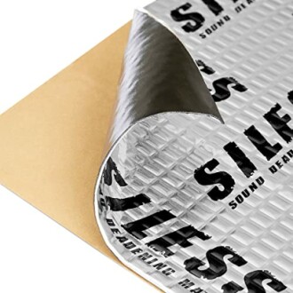 SILES sound deadening mat with peeled corner showing adhesive backing.