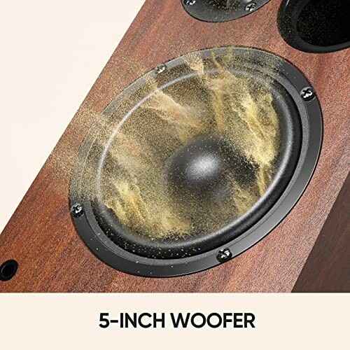 Close-up of a 5-inch woofer speaker with a wooden finish.