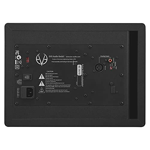 Back panel view of a speaker with various input ports and caution labels.