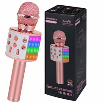 Pink wireless microphone with hi-fi speaker and colorful LED lights next to its packaging box.