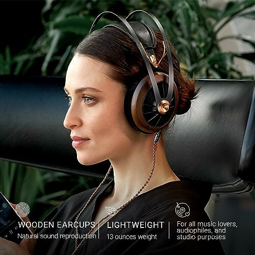 Woman wearing wooden earcup headphones with text highlighting features.