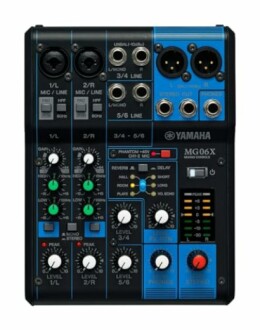 Yamaha MG06X audio mixer with multiple knobs and inputs.